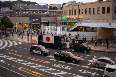 Tokyo, Japan, November 5 2023: Bustling street scene near Ueno Station with pedestrians and Japanese...
