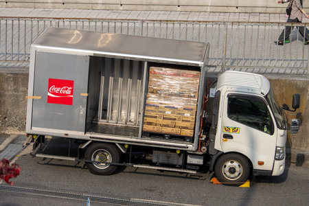 Tokyo, Japan, November 5 2023: Delivery truck unloading Coca-Cola productsのeditorial素材