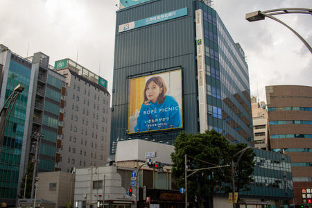 Tokyo, Japan, November 5 2023: Urban billboard advertisement with a female modelのeditorial素材