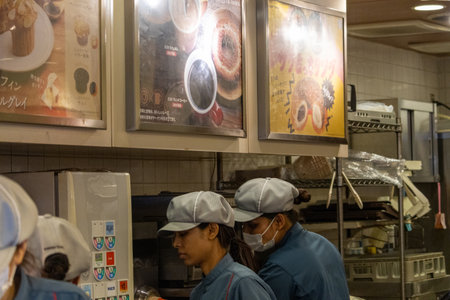 Tokyo, Japan, November 5 2023: Staff working at a bakery counterのeditorial素材