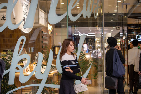 Tokyo, Japan, November 5, 2023: Woman Shopping at Cosmetics Storeのeditorial素材