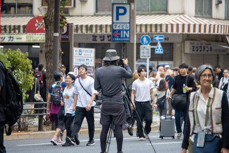 Tokyo, Japan, November 5, 2023: Photographer capturing street sceneのeditorial素材