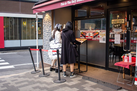 Tokyo, Japan, November 5 2023: Customers at Fast Food Restaurant Counterのeditorial素材