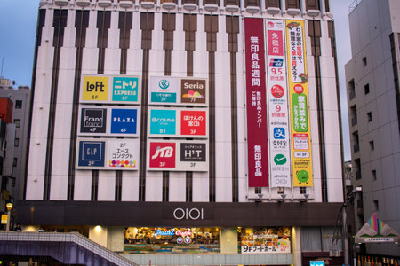 Tokyo, Japan, November 5 2023: Urban building facade with multiple commercial signsのeditorial素材