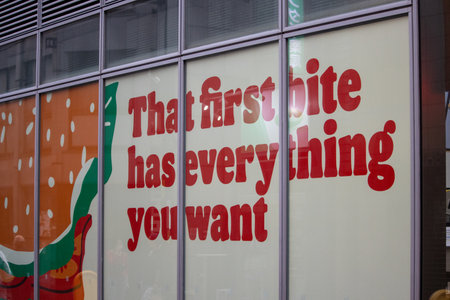 Tokyo, Japan, November 4 2023: Advertisement on a Window Displayのeditorial素材