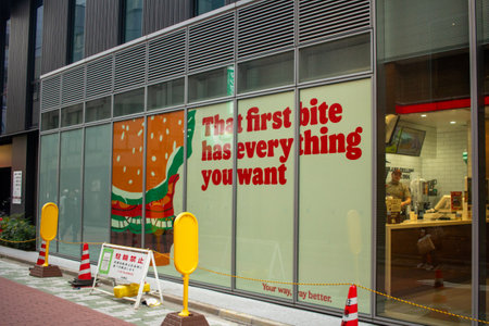 Tokyo, Japan, November 5 2023: Fast Food Restaurant Window Advertisementのeditorial素材