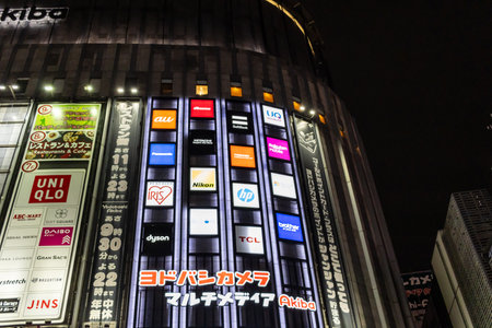 Tokyo, Japan, November 6 2023: Illuminated Billboards on a Building Facade at Nightのeditorial素材