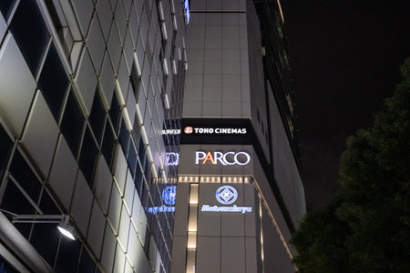 Tokyo, Japan, November 6 2023: Night View of Illuminated Building Facades with Brand Signageのeditorial素材