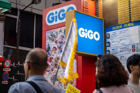 Tokyo, Japan, November 6 2023: Bustling Street Scene with Gigo Signageのeditorial素材