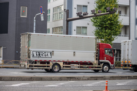 Tokyo, Japan, November 6 2023: Delivery Truck on Urban Streetのeditorial素材
