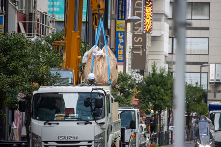 Tokyo, Japan, November 6 2023: Urban street scene with construction crane and truckのeditorial素材