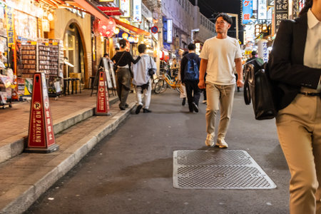 Tokyo, Japan, November 7, 2023: Evening street view with pedestriansのeditorial素材