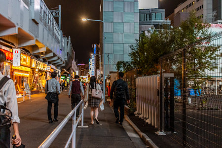 Tokyo, Japan, November 7, 2023: Nightlife scene with pedestrians in Tokyoのeditorial素材