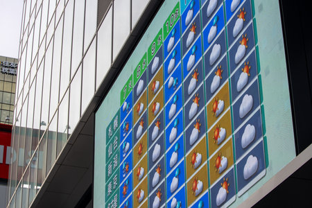 Tokyo, Japan, November 6, 2023: Colorful Urban Billboard Displaying Mobile Appsのeditorial素材