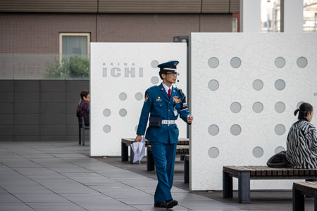 Tokyo, Japan, November 6, 2023: Security guard patrolling in Akihabaraのeditorial素材