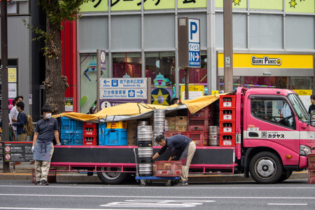 Tokyo, Japan, November 6, 2023: Street scene with delivery truck and workersのeditorial素材