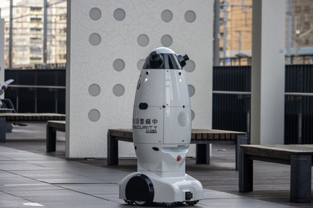 Tokyo, Japan, November 6, 2024: Autonomous Security Robot Patrolling Outdoor Areaのeditorial素材