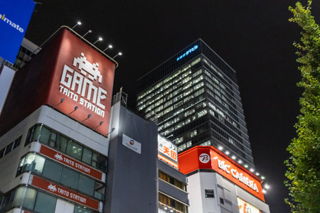 Tokyo, Japan, November 6, 2024: Illuminated Billboards on Urban Buildings at Nightのeditorial素材