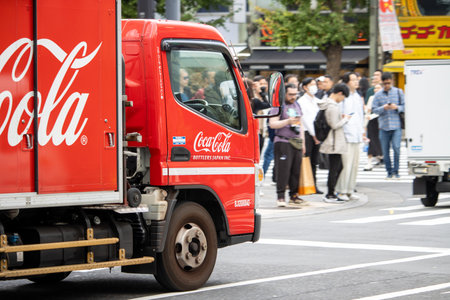 Tokyo, Japan, November 6, 2024: Coca-Cola Delivery Truck in Urban Settingのeditorial素材
