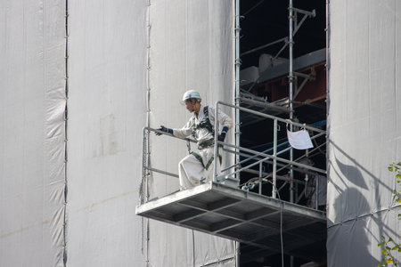 Tokyo, Japan, November 6, 2024: Construction Worker on Scaffolding
