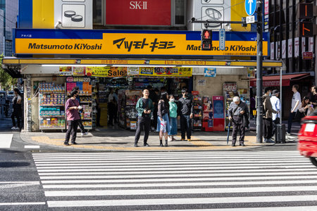 Tokyo, Japan, November 7, 2024: Busy Street Corner with Matsumoto Kiyoshi Storefrontのeditorial素材