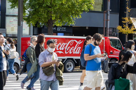 Tokyo, Japan, November 7, 2024: Coca-Cola delivery truck on busy street