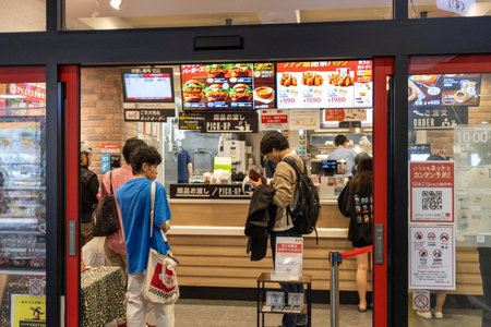 Tokyo, Japan, November 7, 2024: Customers at Fast Food Restaurantのeditorial素材
