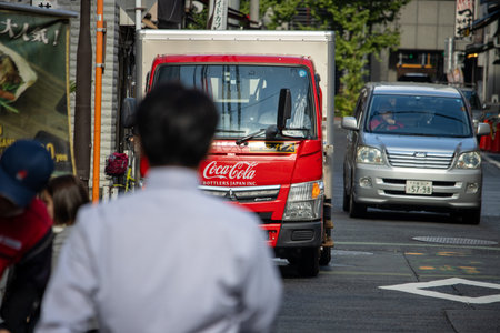 Tokyo, Japan, November 7, 2024: Coca-Cola Delivery Truck in Urban Street