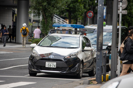 Tokyo, Japan, November 7, 2024: Toyota Police Car Parked on City Streetのeditorial素材