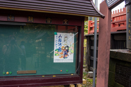 Tokyo, Japan, November 7, 2024: Traditional Shrine Display with Manga Illustrationのeditorial素材
