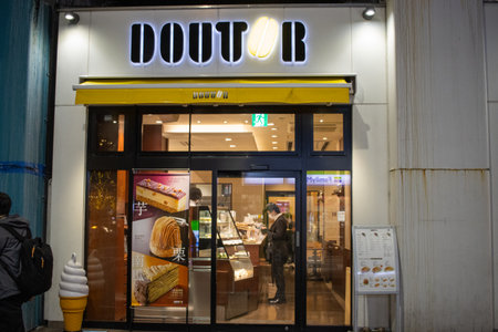 Tokyo, Japan, November 7, 2024: Doutor Coffee Shop Facade at Nightのeditorial素材