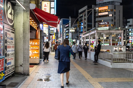 Tokyo, Japan, November 7, 2024: Night Scene in Bustling Shopping Districtのeditorial素材