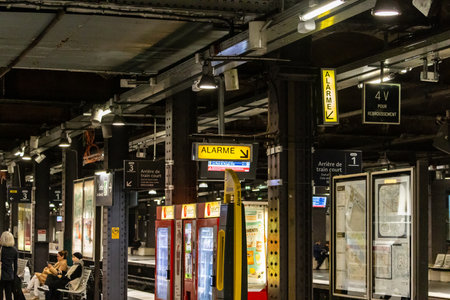 Paris, France, November 9, 2024: Commuters Waiting at Metro Stationのeditorial素材
