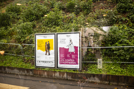 Paris, France, November 9, 2024: Outdoor Opera Posters at Bus Stopのeditorial素材