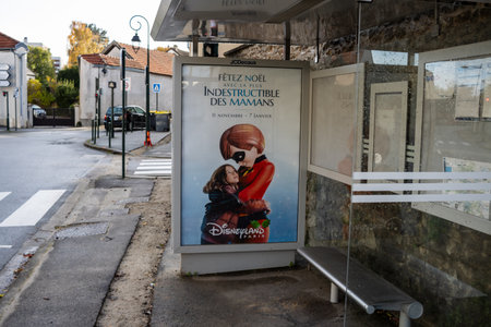 Paris, France, November 9, 2024: Advertisement for Disneyland at Bus Stopのeditorial素材