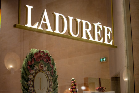 Paris, France, November 9, 2024: Laduree Sign and Christmas Decorations