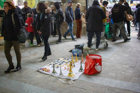 Paris, France, November 9, 2024: Street Vendor Selling Miniature Eiffel Towers