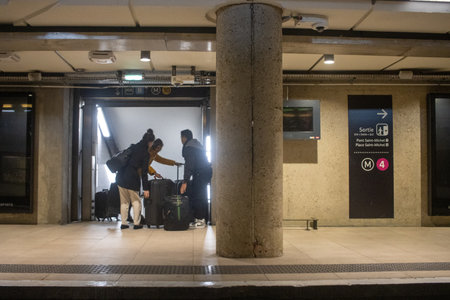 Paris, France, November 8, 2024: Busy Metro Station Moment with Commuters