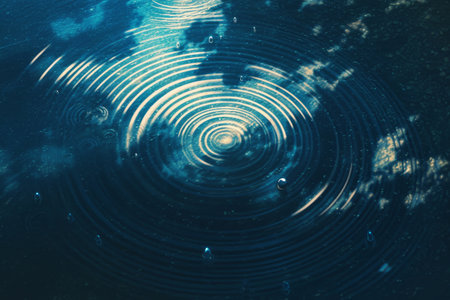 A top-down illustration of a tranquil pond, with raindrops forming concentric ripple patterns on the surface, dynamic and delicate, light and shadow enhancing the soothing atmosphereの素材