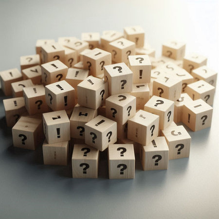 Wooden cubes with question marks on a gray background. Business concept.