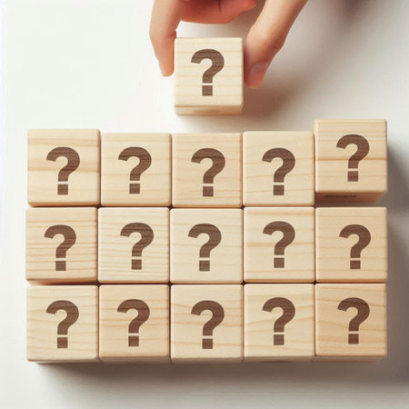 Hand and wooden cubes with question mark on white background, FAQ conceptの写真素材