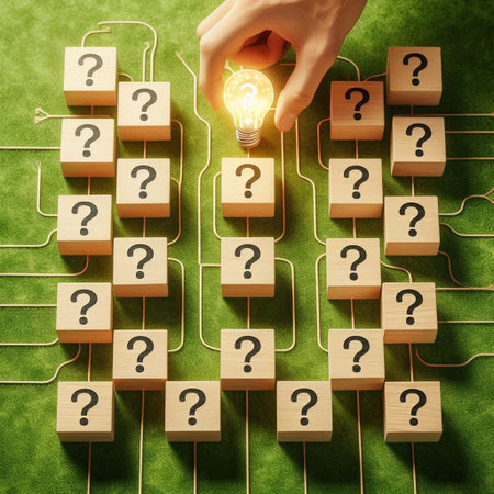 Human hand holding a light bulb over wooden blocks with question marks on green backgroundの写真素材