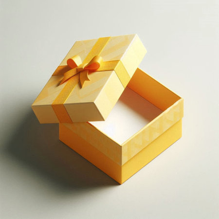 Opened gift box with gold ribbon on a gray background, top view