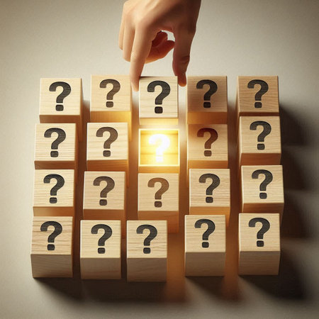 Conceptual image with wooden cubes and human hand touching question markの写真素材