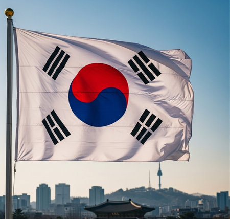 National flag of South Korea waving in the wind with Seoul tower in the background
