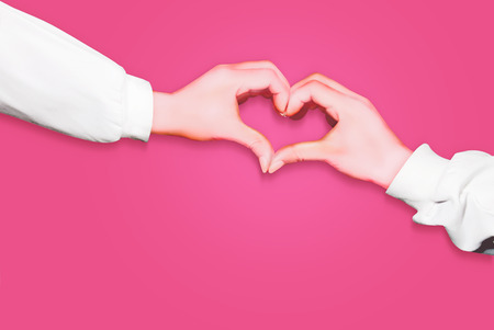 Hands in form of heart isolated on pink background, arms wearing long white sleevesの写真素材