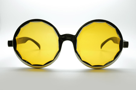 Yellow retro / vintage glasses / eye wear, black frameの写真素材