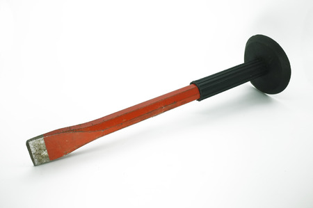 Red chisel with black grip isolated on white background