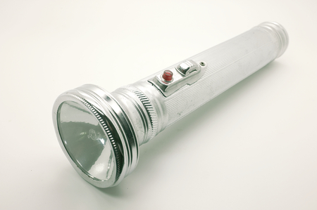 Old metal flashlight, silver torchの写真素材