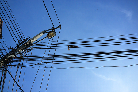 Silhouette squirrel on electric polesの写真素材